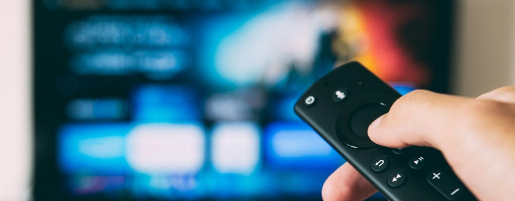 turned-on flat screen television