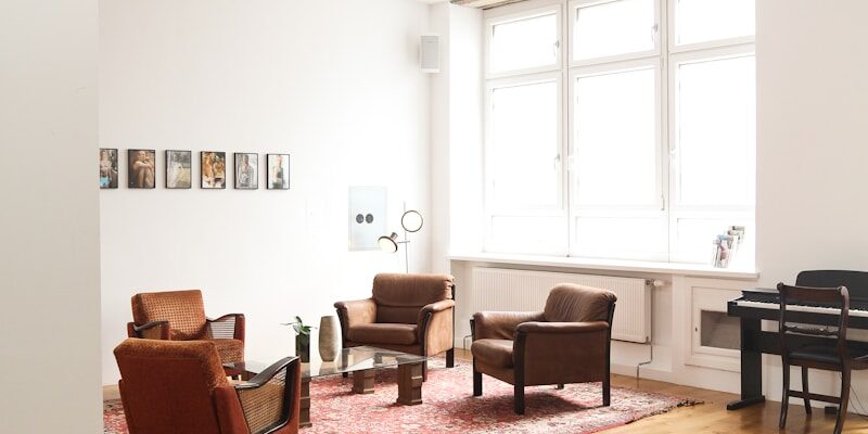living room with brown wooden parquet floor and white wall